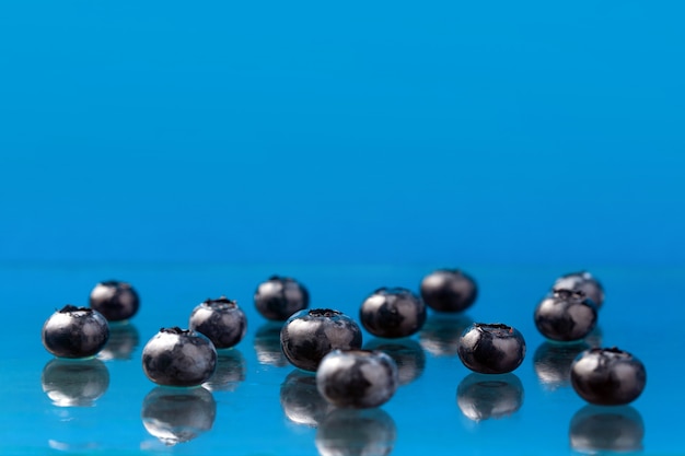 Blueberries on a blue surface