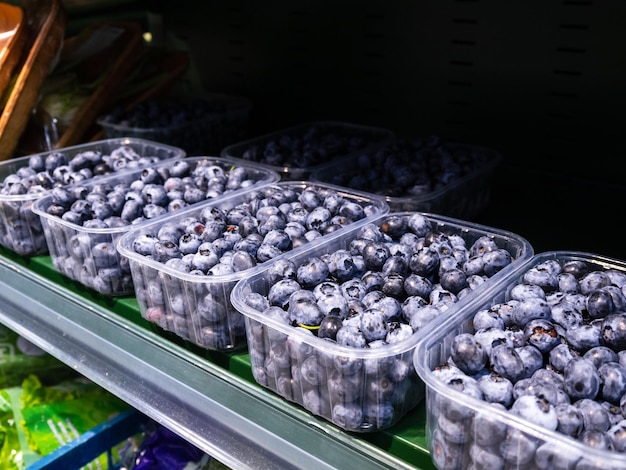 blueberries on the counter in the market