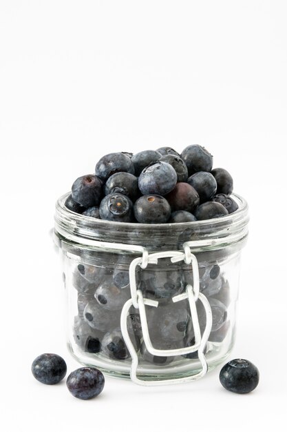 Blueberries in crystal jar isolated