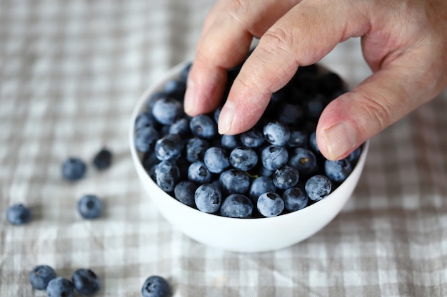 Blueberries in a man's hand.