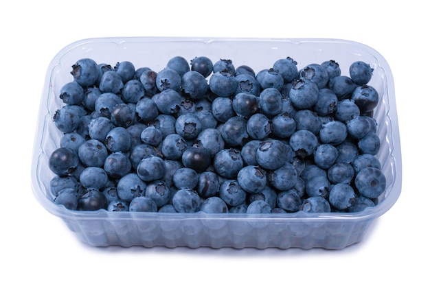 Blueberries in a plastic container isolated on white background