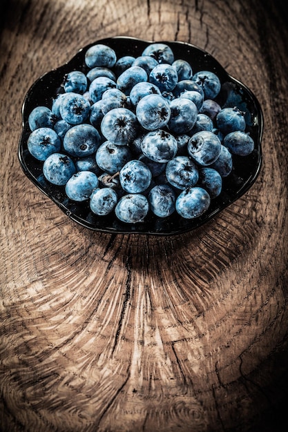 Blueberries on plate vintage grunge board