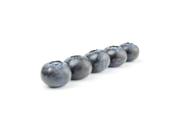 Blueberries in row isolated on white cutout.