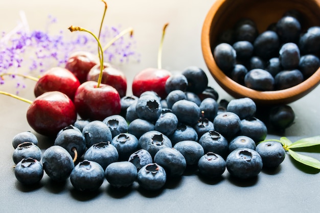 Blueberries with leaves on white background.