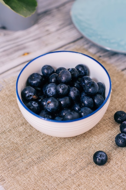 Blueberry berry in a round cup