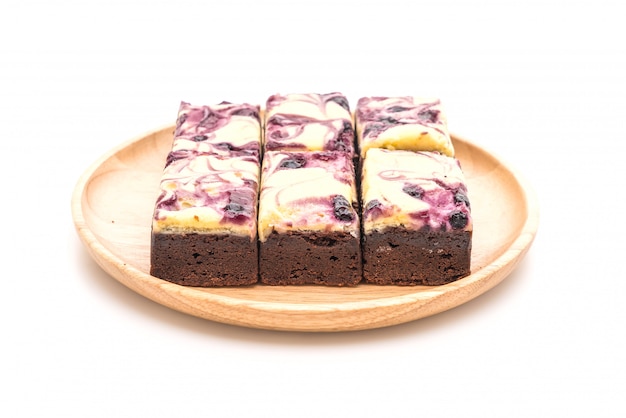 blueberry cheese brownies on white background