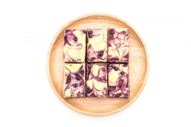 blueberry cheese brownies on white background