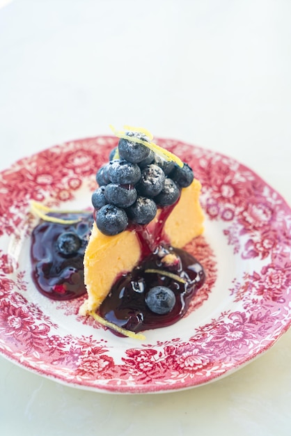 blueberry cheese cake on vintage porcelain plate