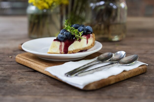 Blueberry cheese cake on wooden table