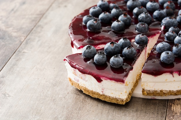 Blueberry cheesecake on wooden table