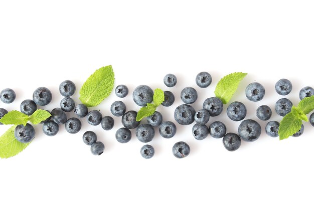 Blueberry and mint leaves on a white background top view place for text