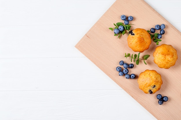 Blueberry muffin. Homemade baked cupcake with blueberries, fresh berries, mint