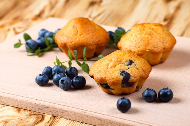 Blueberry muffin. Homemade baked cupcake with blueberries, fresh berries, mint 