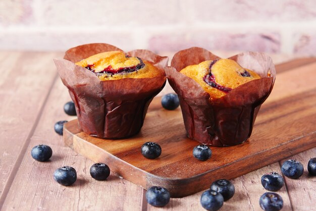 Blueberry muffins on table with copy space