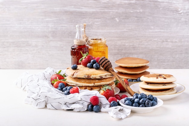 Blueberry pancakes served with honey