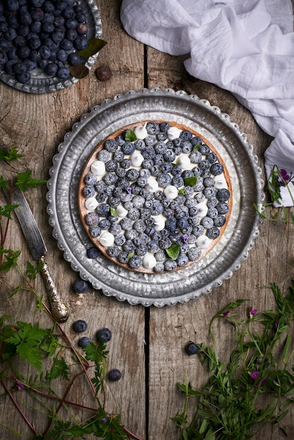 Blueberry pie on rustic wooden table