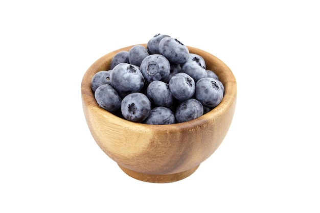 Blueberry in round wooden bowl isolated on white background