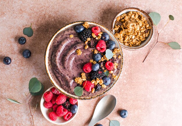 Blueberry Smoothie Bowl with Granola Banana and Chia Seeds Healthy Food Vegan or Vegetarian Diet Food Concept Bright Background