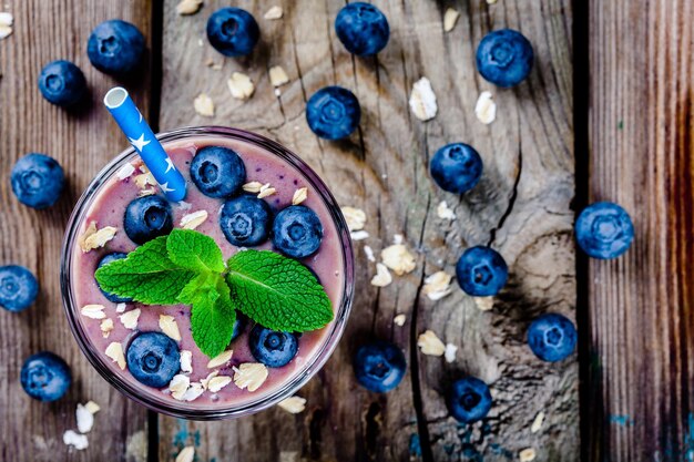 Blueberry smoothie in a glass Above view