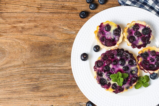 Blueberry tart, pie, tartlet with vanilla custard.