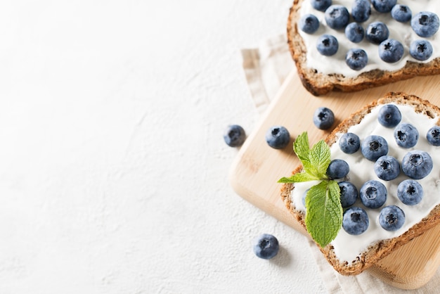 Blueberry toast on breakfast on white background. Healthy food