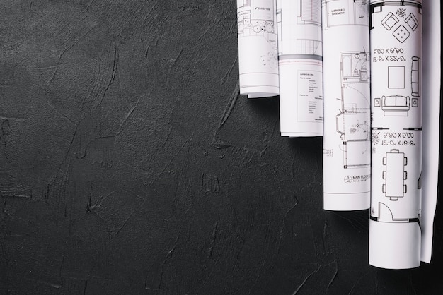 Blueprints on black table