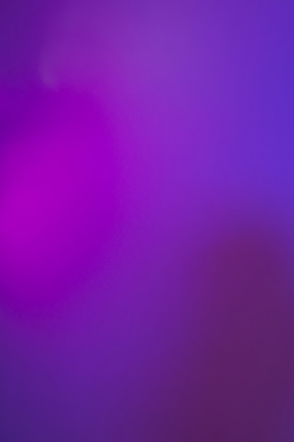 Photo blur abstract defocused background dark tone multicolor light.