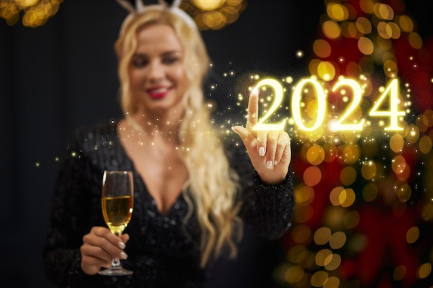 Blur background of of blonde woman touching showing at center on golden description numbers of new