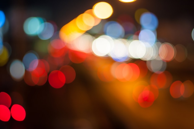 Blur and colorful circle bokeh on night highway background