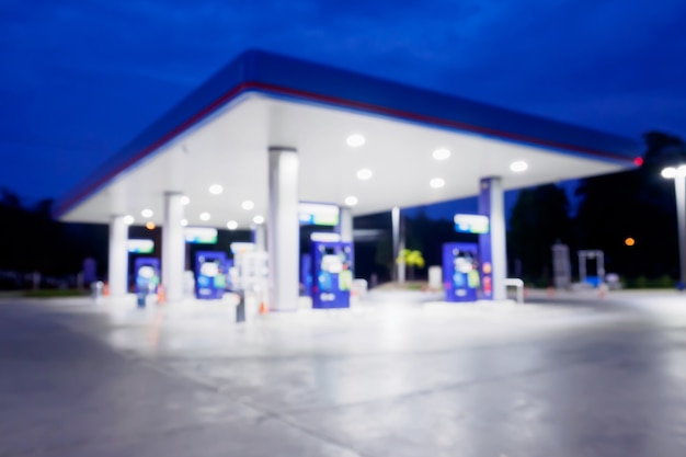 Blur gas station at night time for background