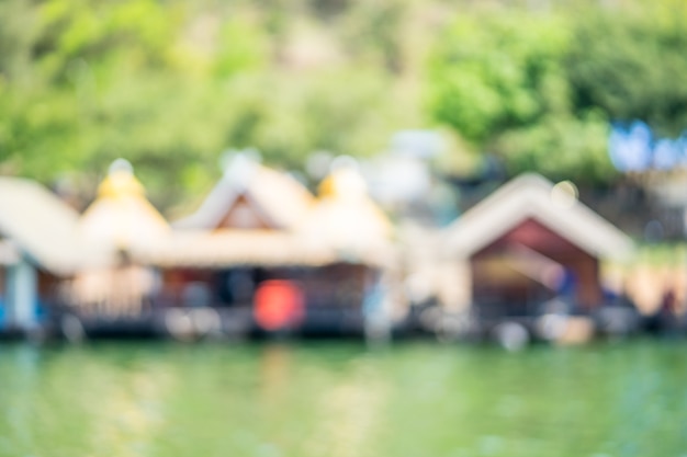 Blur of houseboat in the water in Srinakarin Dam