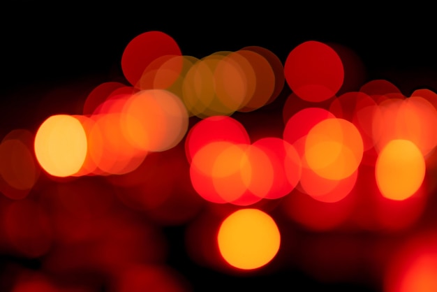 Blur red and orange bokeh on dark background Abstract background of city light Bokeh light