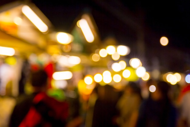 Blur with bokeh of night market at the city background