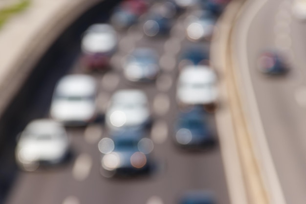 Blurred abstract background of traffic cars on the multi lane highway during rush hour