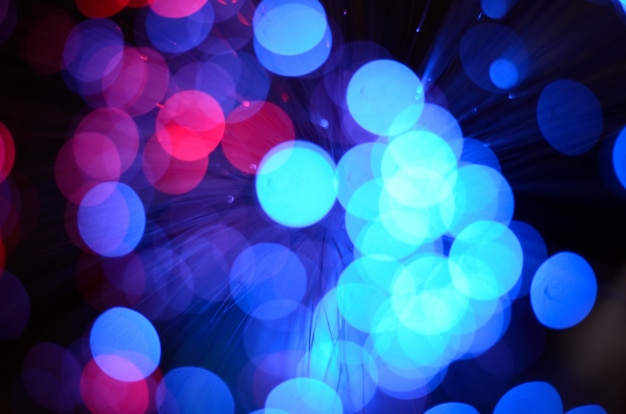 Photo blurred abstract pink and blue bokeh lights.