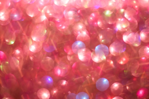 Photo blurred abstract red glitter bokeh defocused lights holiday and valentines day concept