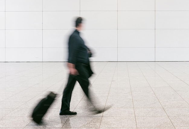 Blurred anonymous businessman at a airport