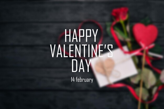 Blurred background. Banner with the words "happy Valentine's Day". Top view. Black background.