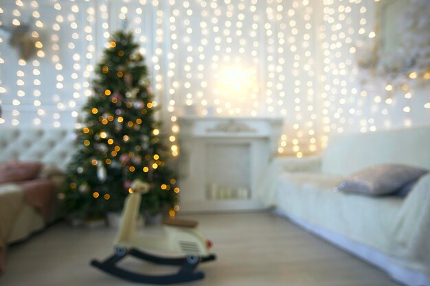 Blurred background of Christmas room with golden bokeh