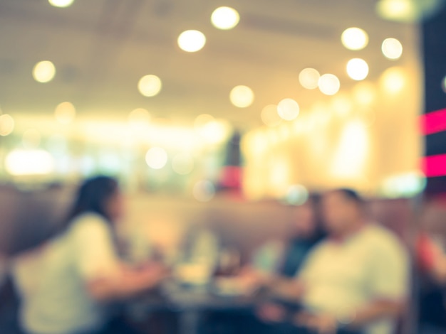 Blurred background, empty table at restaurant blur background with bokeh and vintage tone.