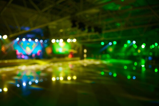 Photo blurred background of event concert lighting at conference hall