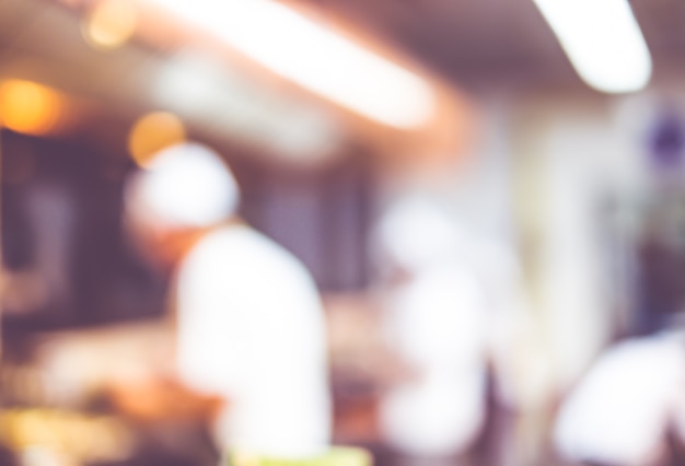 Blurred background: Groups of Chef cooking in the open kitchen