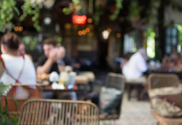 Blurred background of people in the cafe Tropical style cafe