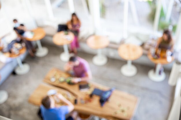 Photo blurred background of restaurant with abstract bokeh light. can be used as background