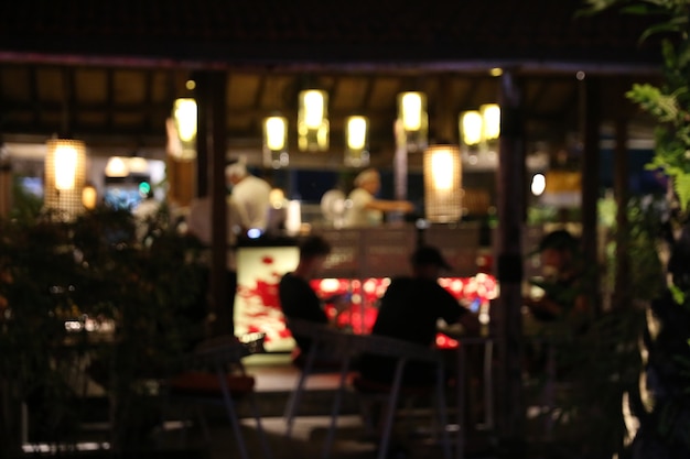 Blurred background of restaurant with abstract bokeh light.