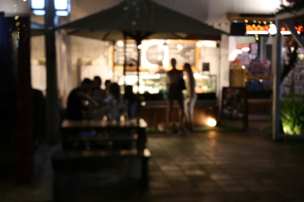 Photo blurred background of restaurant with abstract bokeh light.