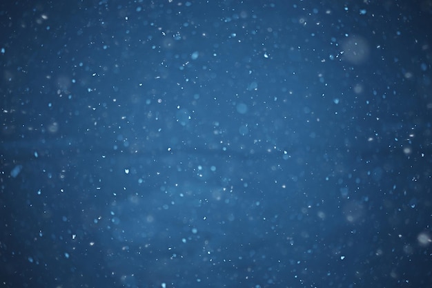 blurred background snowfall nature, abstract falling snowflakes design