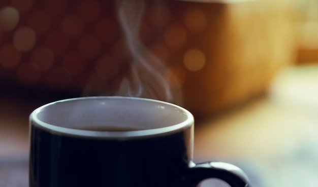 Blurred background view on the morning coffee on the table close up