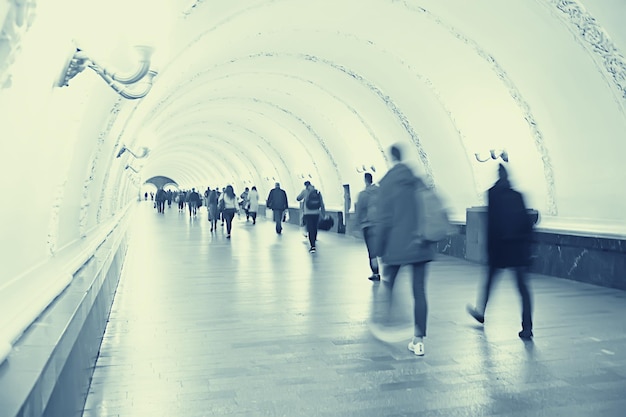 Blurred background walking people crowd legs / gray background\
movement traffic abstract people crowd, concept city