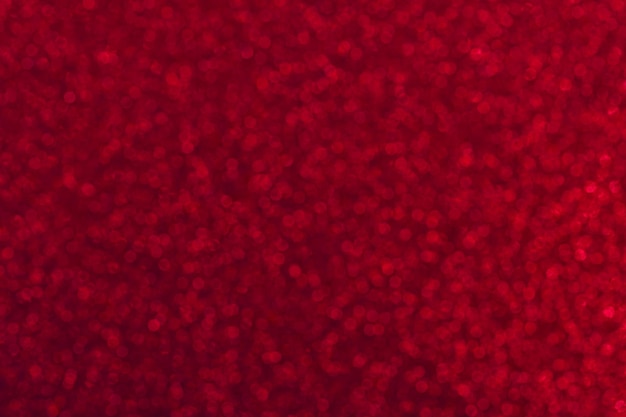 Blurred background with bokeh garnet color background with sparkles and glitters